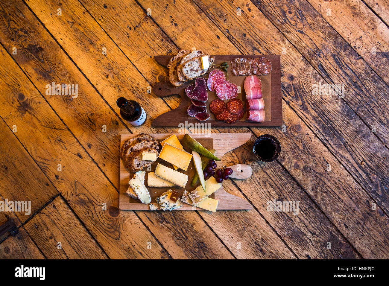 Charcuterie and cheese platters with craft beer and red wine. Stock Photo