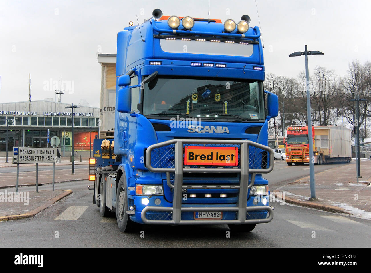 HELSINKI, FINLAND - JANUARY 16, 2017: Two Scania semi oversize wide load transports of prefabricated house module drive out from South Harbor in Helsi Stock Photo