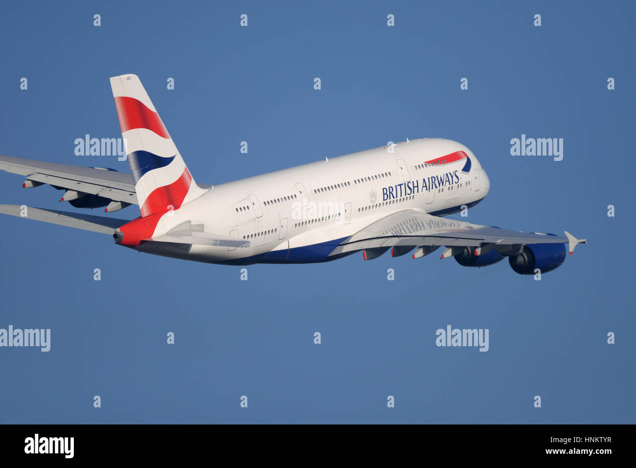 British Airways Airbus A380-841 G-XLEL taking off from London Heathrow Airport in blue sky. Space for copy Stock Photo