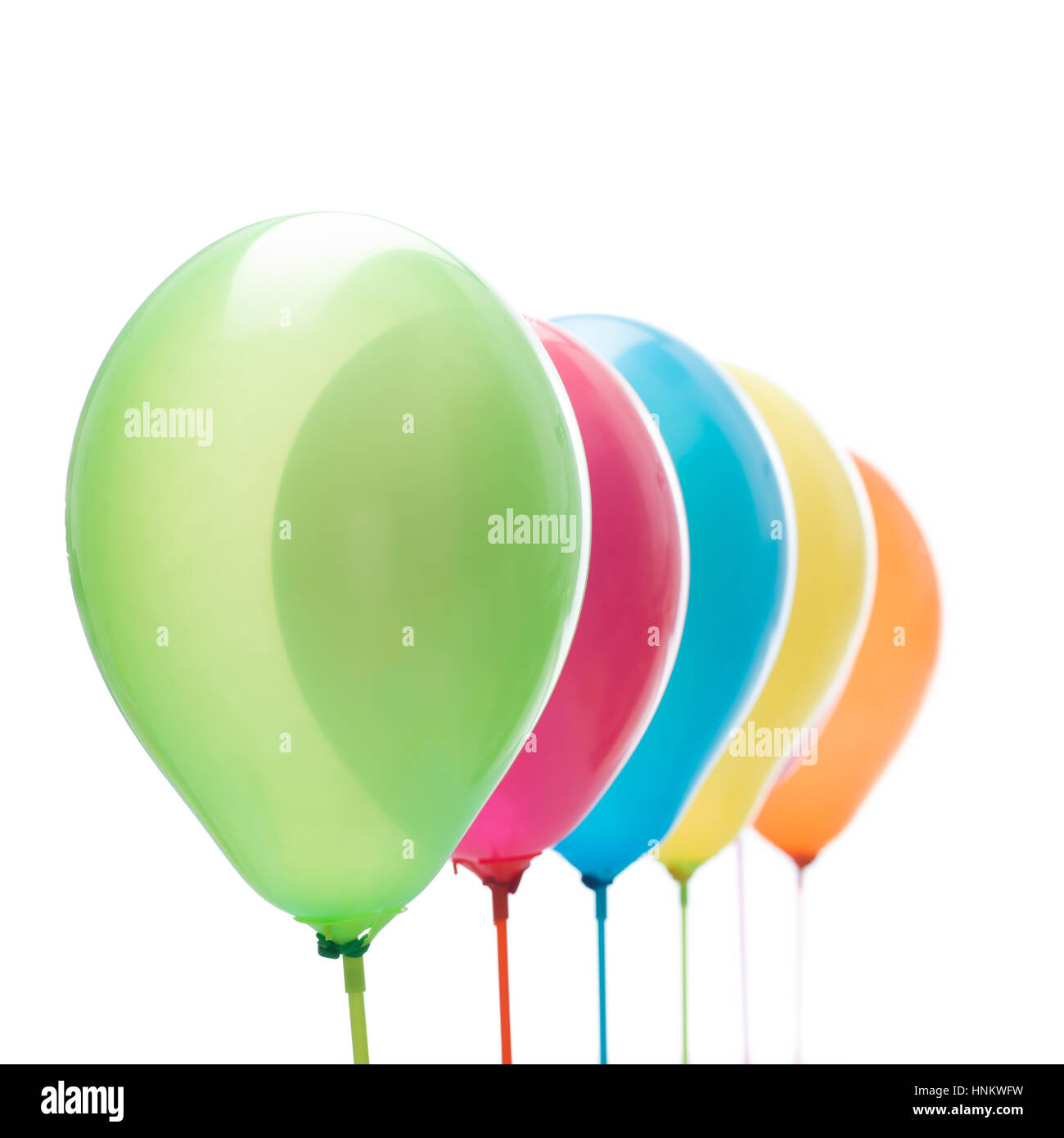 square image overlay of colorful balloons on sticks white background Stock Photo