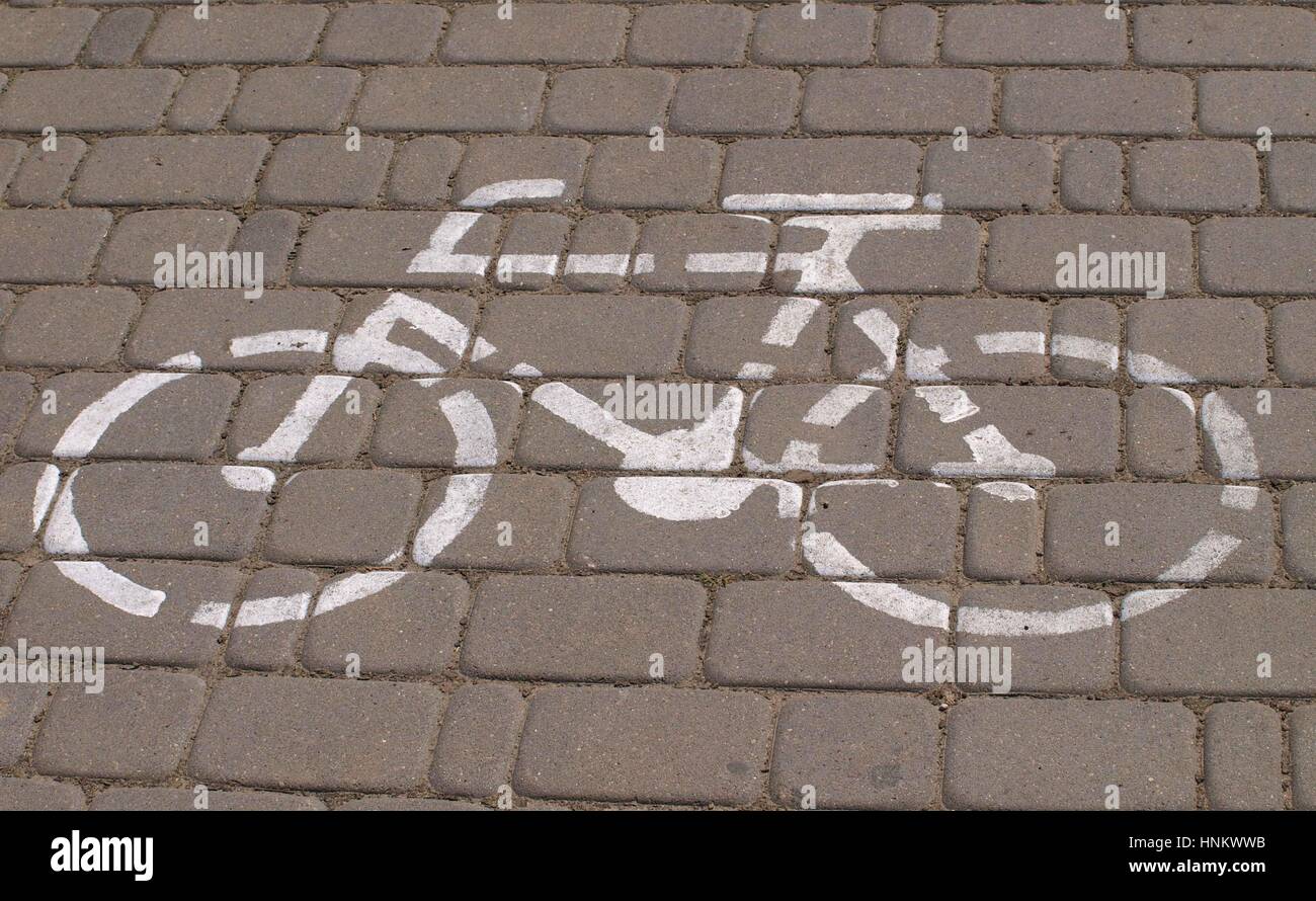 Bike sign on brick pavement Stock Photo Alamy