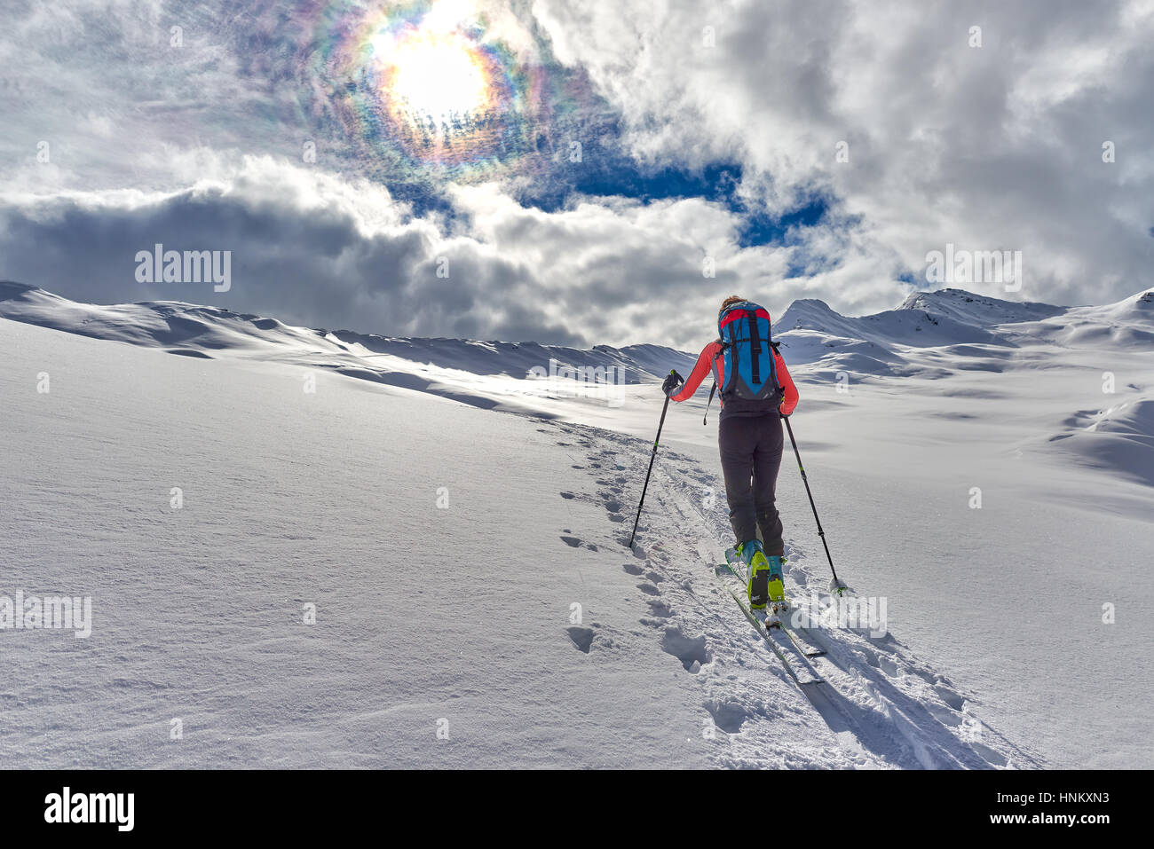 uphill girl with seal skins and ski mountaineering on the alps Stock