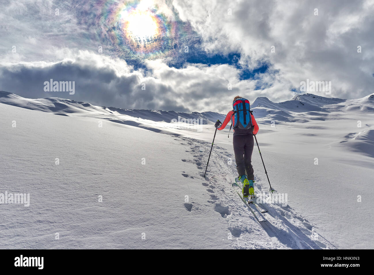 uphill girl with seal skins and ski mountaineering on the alps Stock Photo