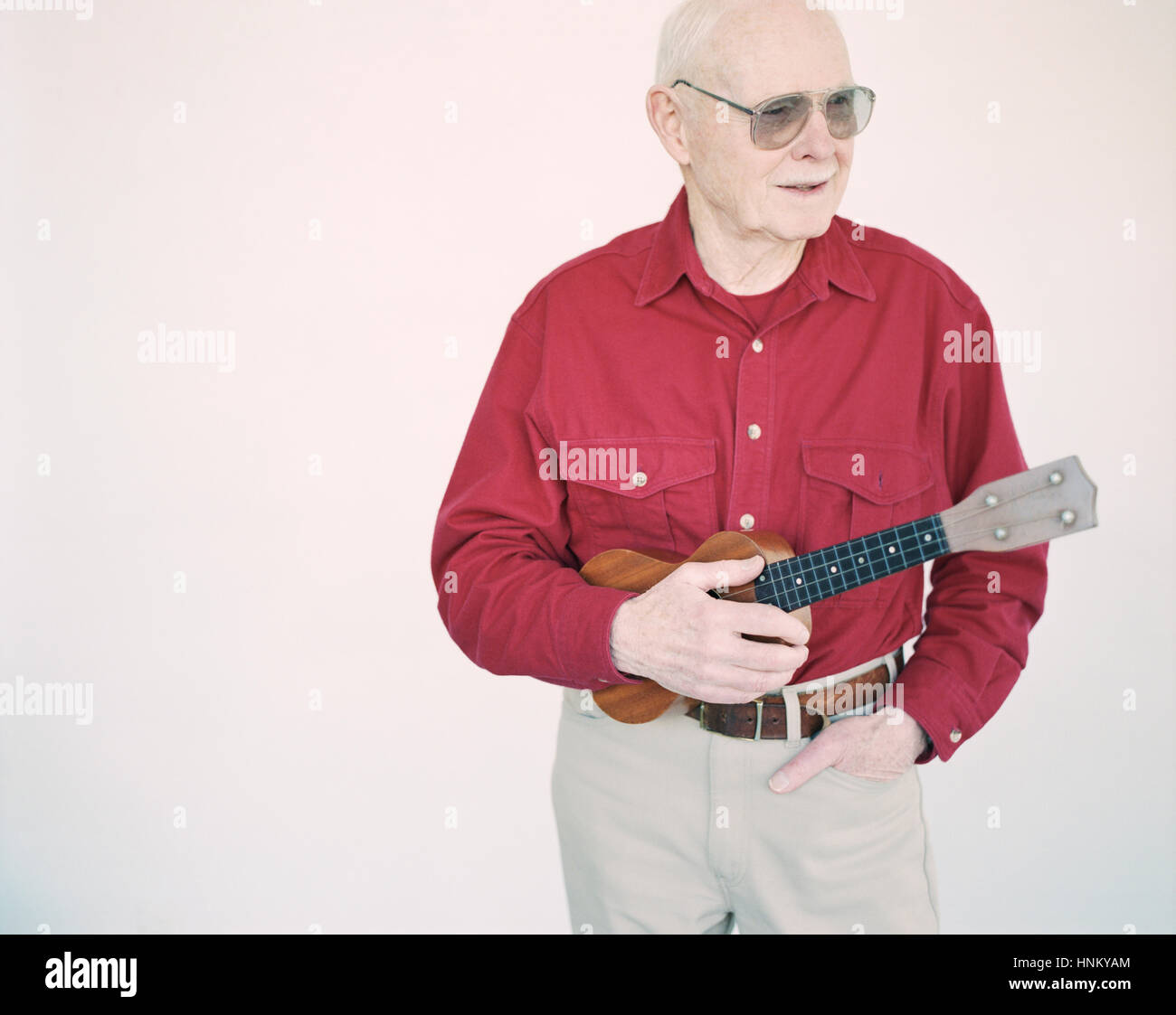 Elderly man in red shirt hi-res stock photography and images - Alamy