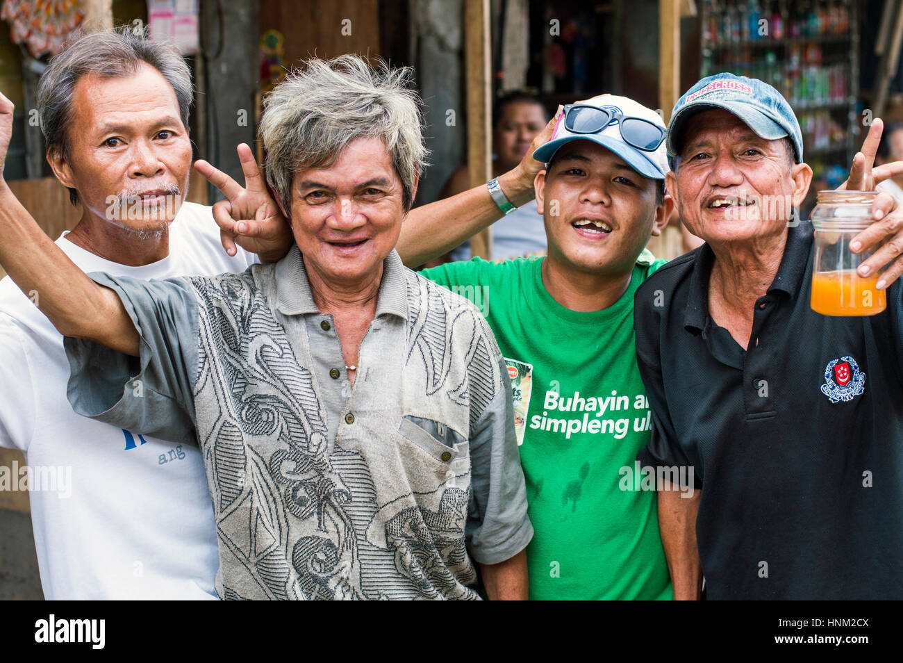 Men in slum by Bangkerohan River, Davao, Davao Del Sur, Philippines Stock Photo