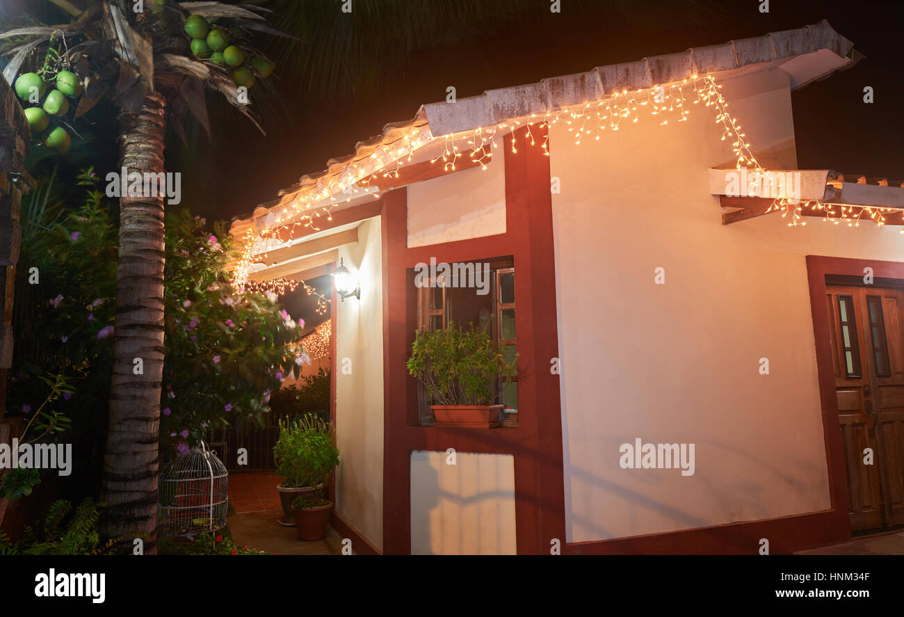 Christmas home decoration outdoor with palm coconut tree at night Stock Photo