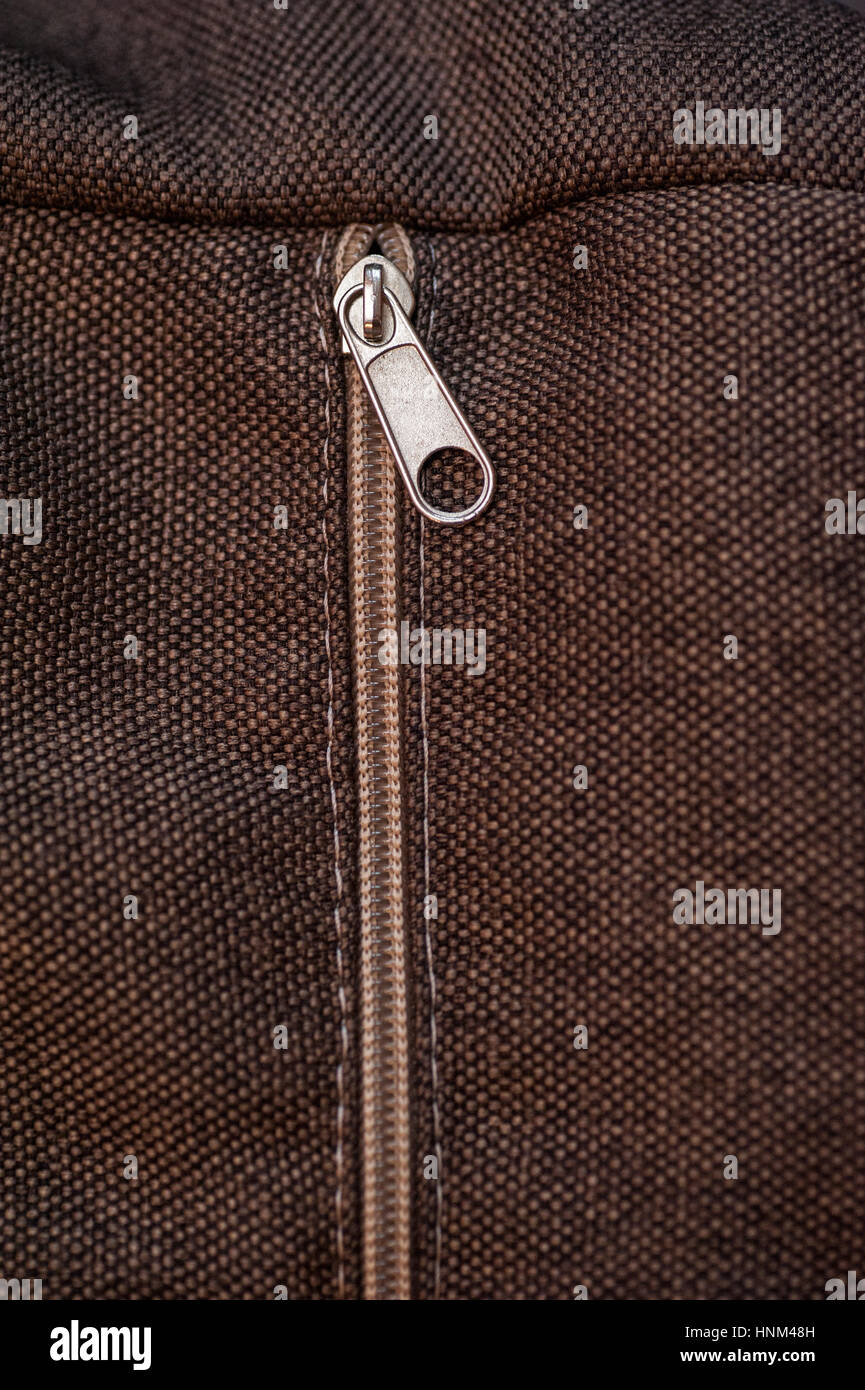 texture of brown fabric with zipper for background Stock Photo