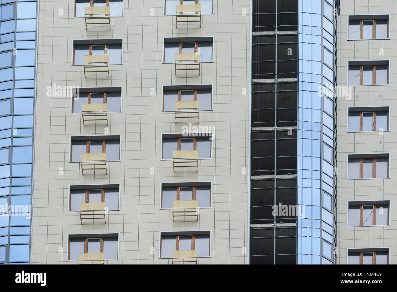 part of a modern multi-storey office building with balconies and windows Stock Photo
