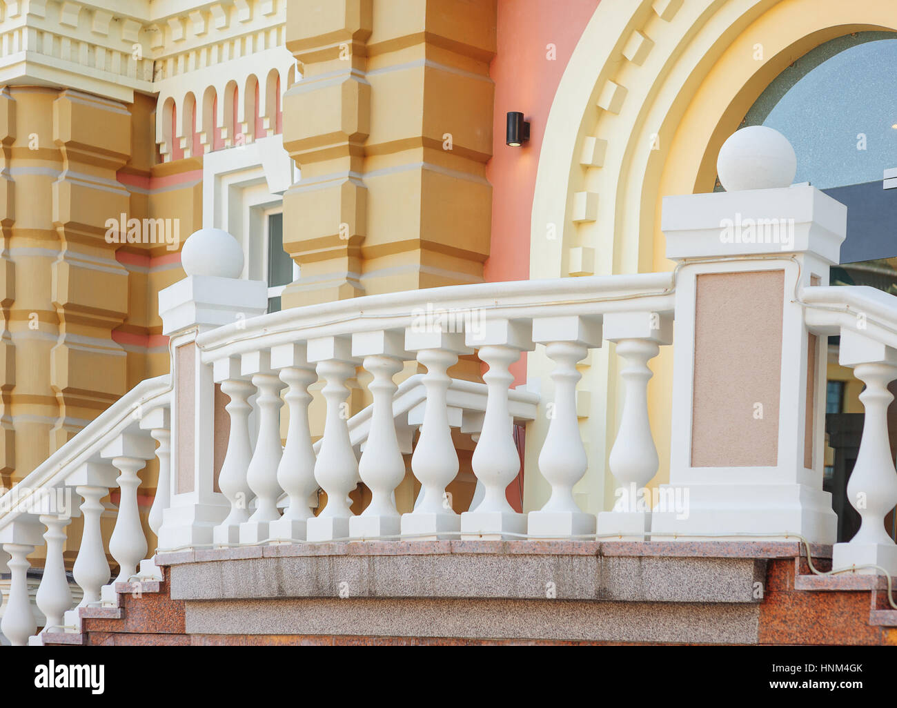 part of old architectural buildings with white balcony balustrades Stock Photo
