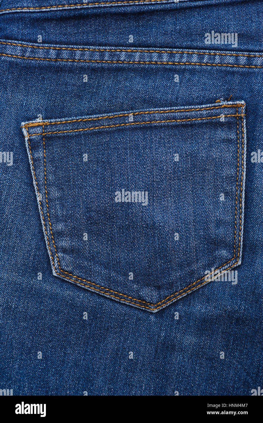 blue texture of jeans, stitching on the pants closeup Stock Photo