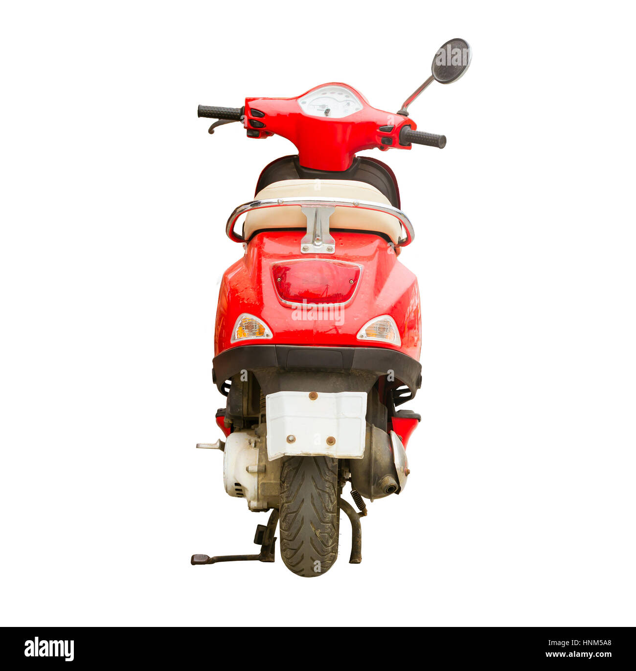 Red scooter isolated on background. Stylish bright hipster two-wheeled moped is the perfect vehicle for the narrow streets of the resort and congested Stock Photo