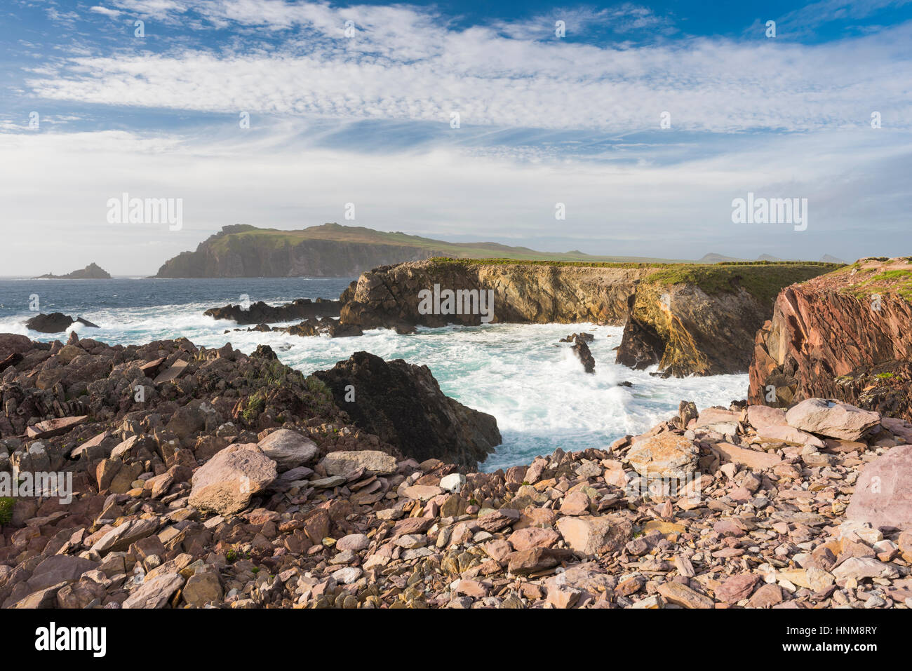 Looking towards Sybil Head across a very choppy sea with beautiful clouds, from the coastal path at Clogher, Dingle Peninsula, County Kerry, Ireland Stock Photo