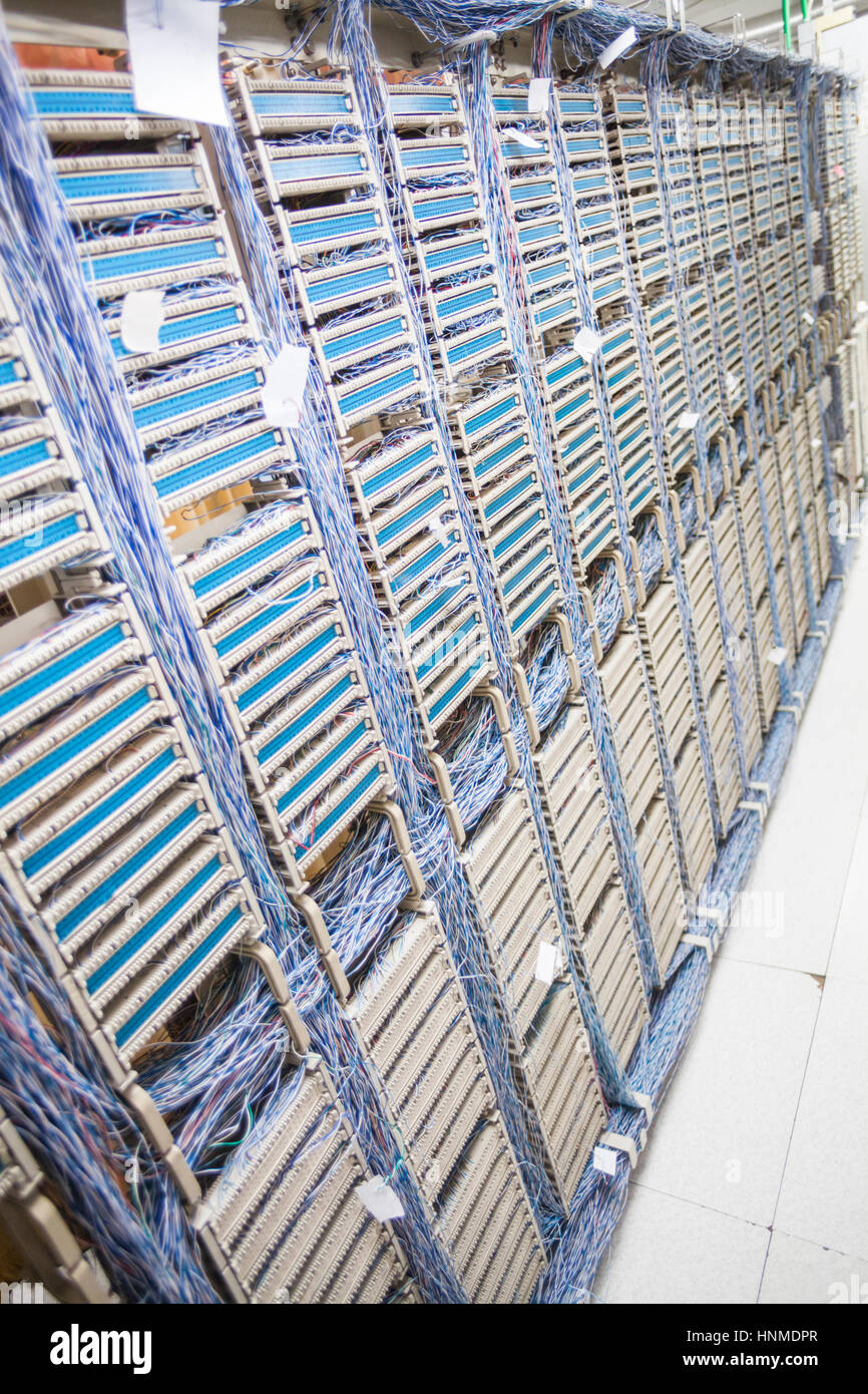 Color image of an old telephone exchange wit many wires. Stock Photo