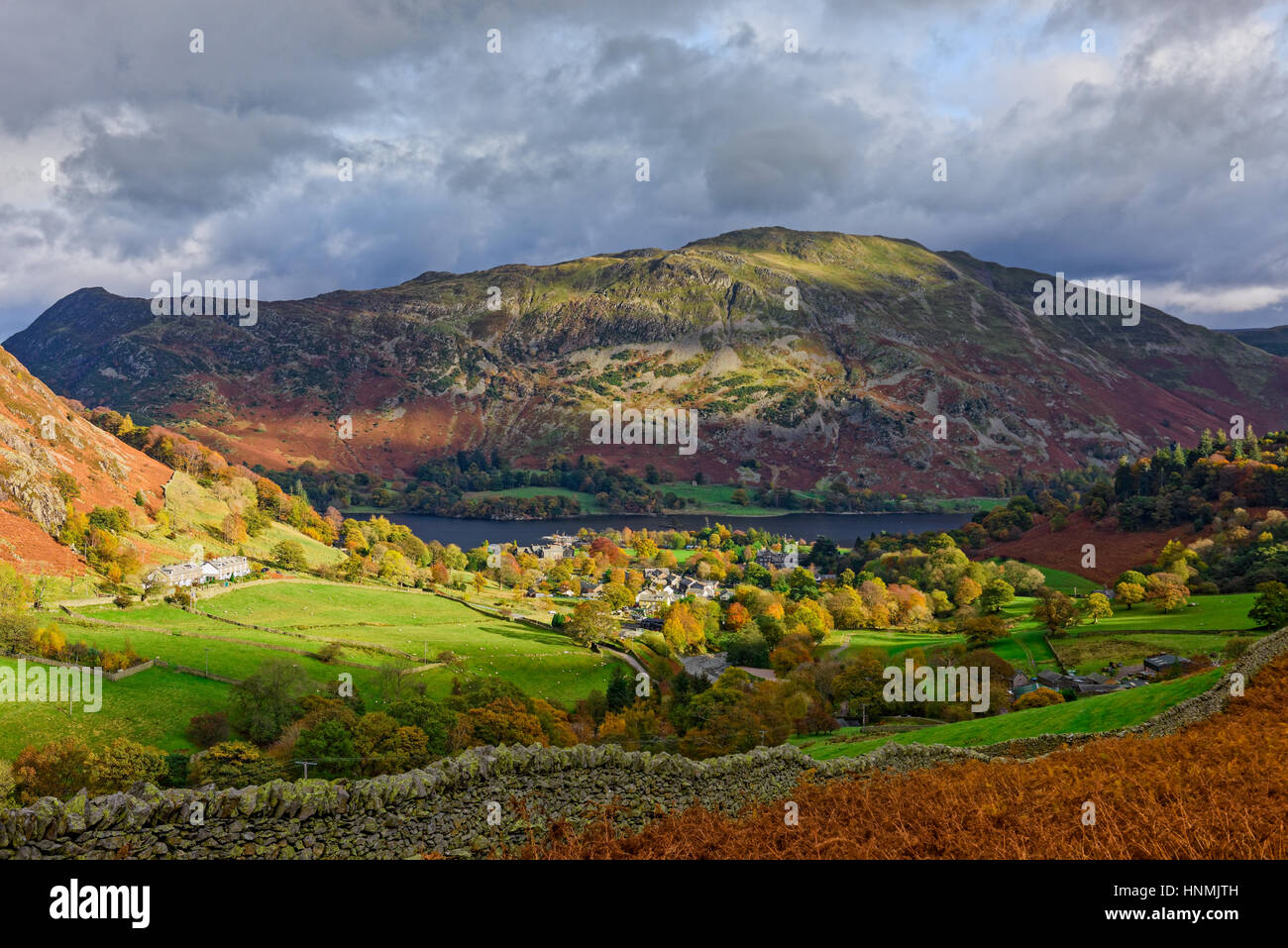 View over Glenridding and Ullswater with Place Fell beyond. Lake District National Park, Cumbria, England. Stock Photo