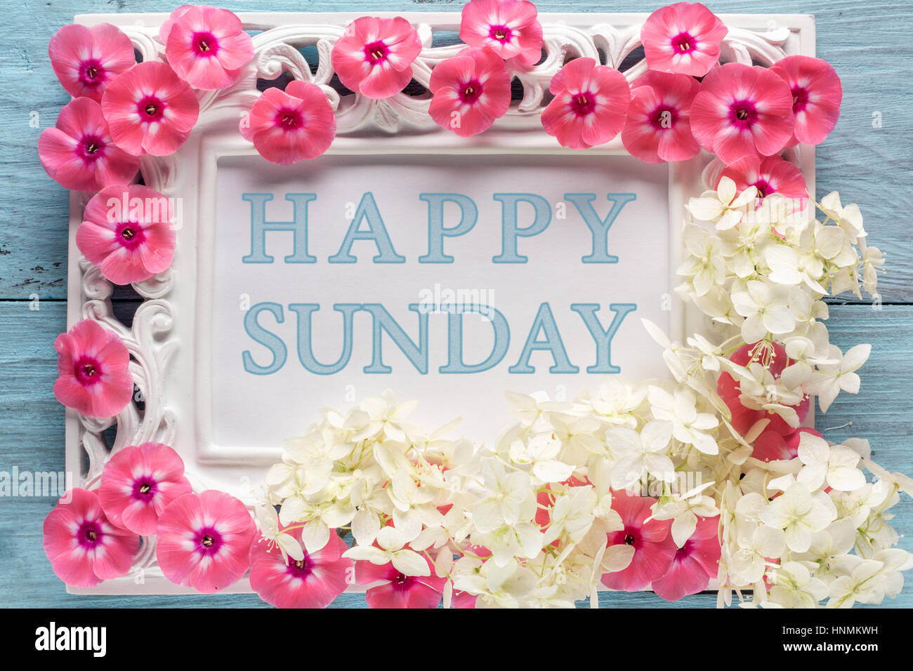 Frame with flowers and text: Happy sunday Stock Photo - Alamy