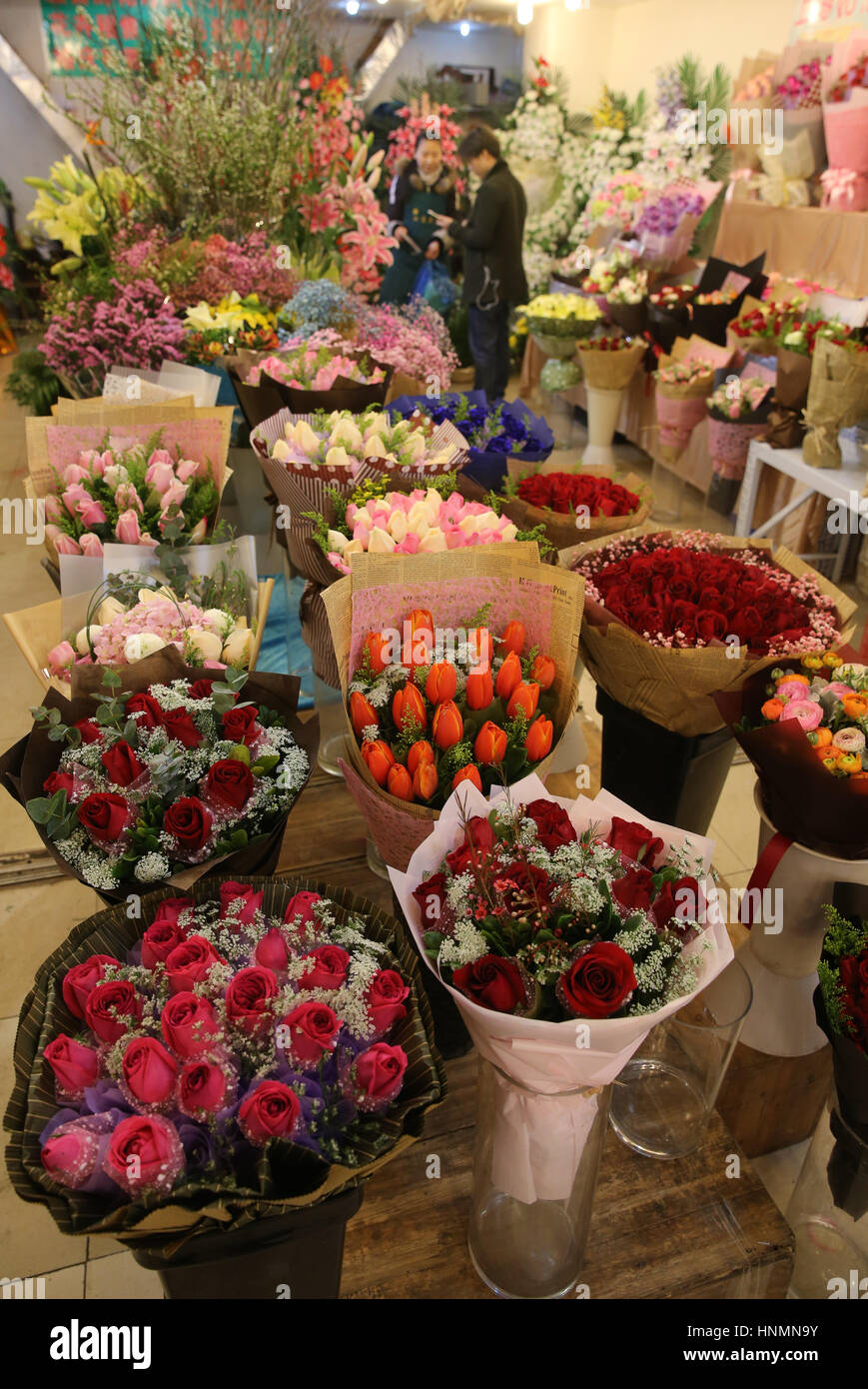 Shanghai, China. 14th Feb, 2017. Flowers are seen in a shop in Caojiadu