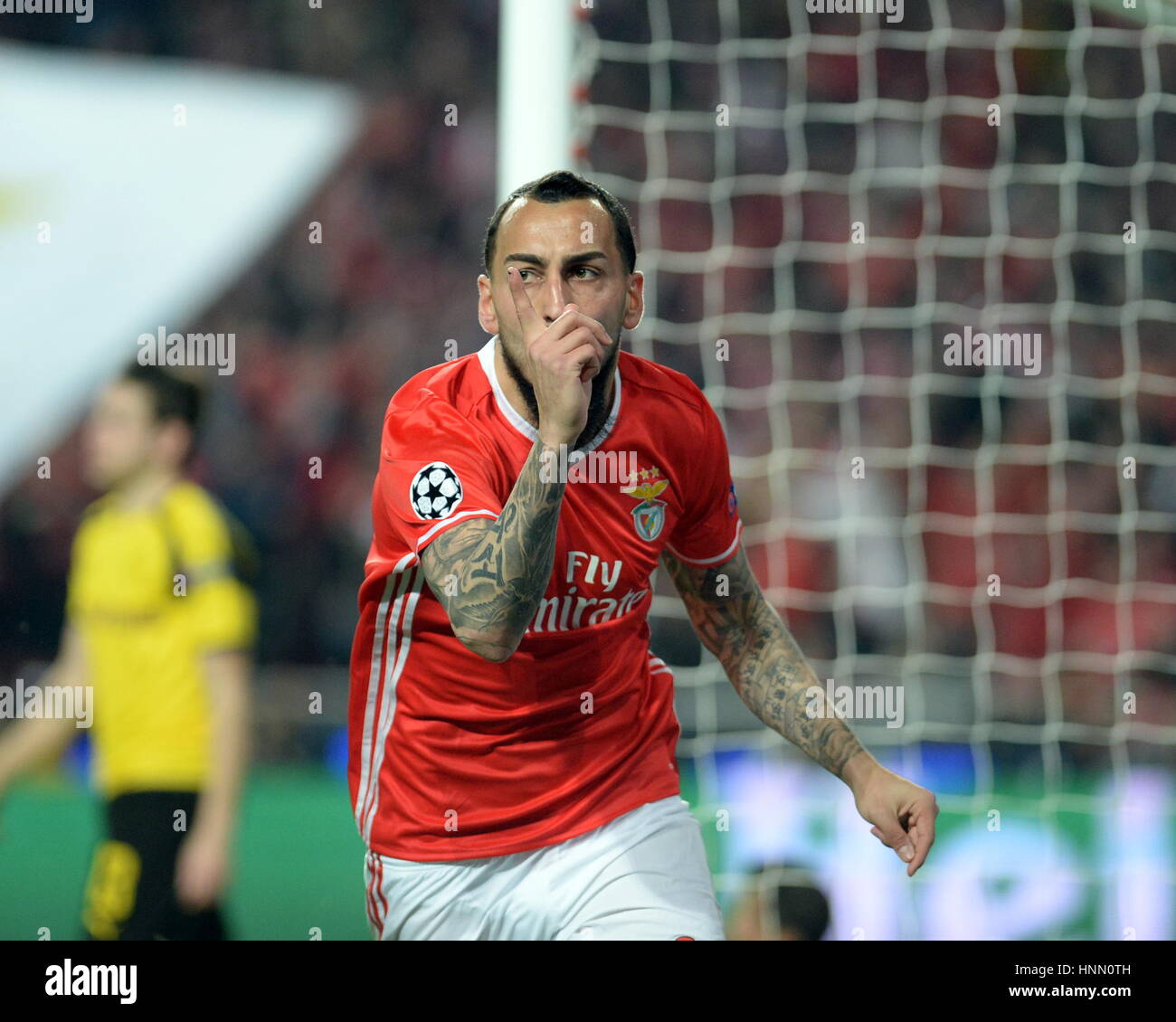 Lisbon, Portugal. 14th Feb, 2017. Benfica's Kostas Mitroglou celebrates scoring during the first leg match of Round of 16 of the UEFA Champions League between SL Benfica and Borussia Dortmund at Luz stadium in Lisbon, Portugal, Feb. 14, 2017. Benfic won 1-0. Credit: Zhang Liyun/Xinhua/Alamy Live News Stock Photo