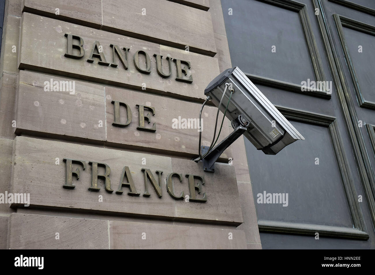 The lettering "Banque de France" and a surveillance camera on the facade of  the French Central