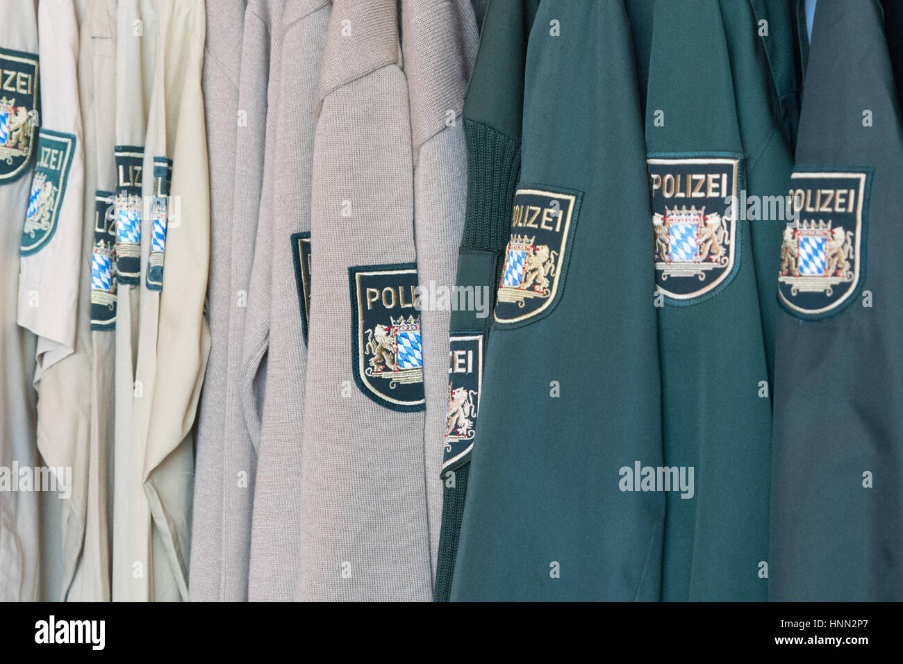 Straubing, Germany. 15th Feb, 2017. Old police uniforms hang on a coatrack in Straubing, Germany, 15 February 2017. The old, green uniforms will be remodeled after the Bavarian Police switches to blue uniforms. Photo: Armin Weigel/dpa/Alamy Live News Stock Photo