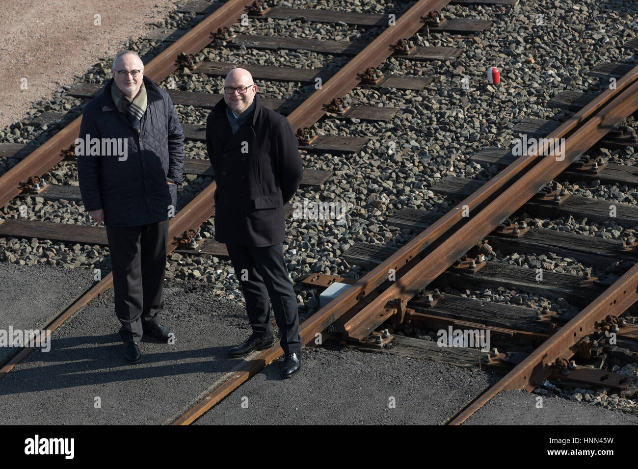 Hamburg, Germany. 15th Feb, 2017. Ingo Egloff (L) and Axel Mattern, Chiefs of Port of Hamburg Marketing, stand at the site of the Eurokombi logistics company during a press conference in the Port of Hamburg, Germany, 15 February 2017. The Port of Hamburg had a slight increase in turnover thanks to a strong final spurt last year. Photo: Christian Charisius/dpa/Alamy Live News Stock Photo