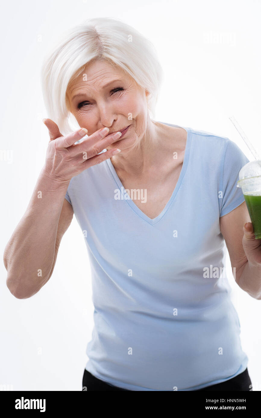 Surprised mature woman pulling a face Stock Photo