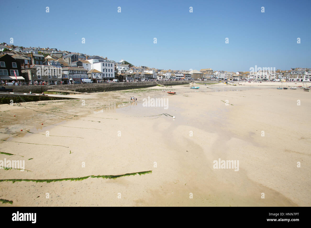ST IVES Cornwall England 2013 Seaside resort and holiday resort at the English south coast 2013 people out at beach at low tide Stock Photo