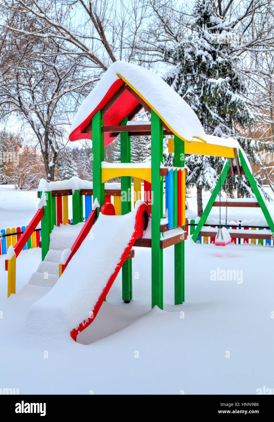 Children's playground covered with snow in winter Stock Photo - Alamy