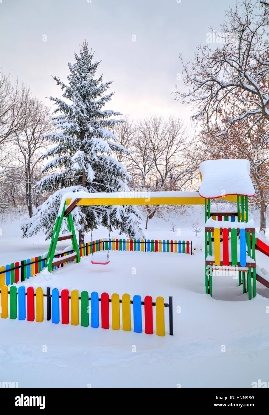 Children's playground covered with snow in winter Stock Photo - Alamy