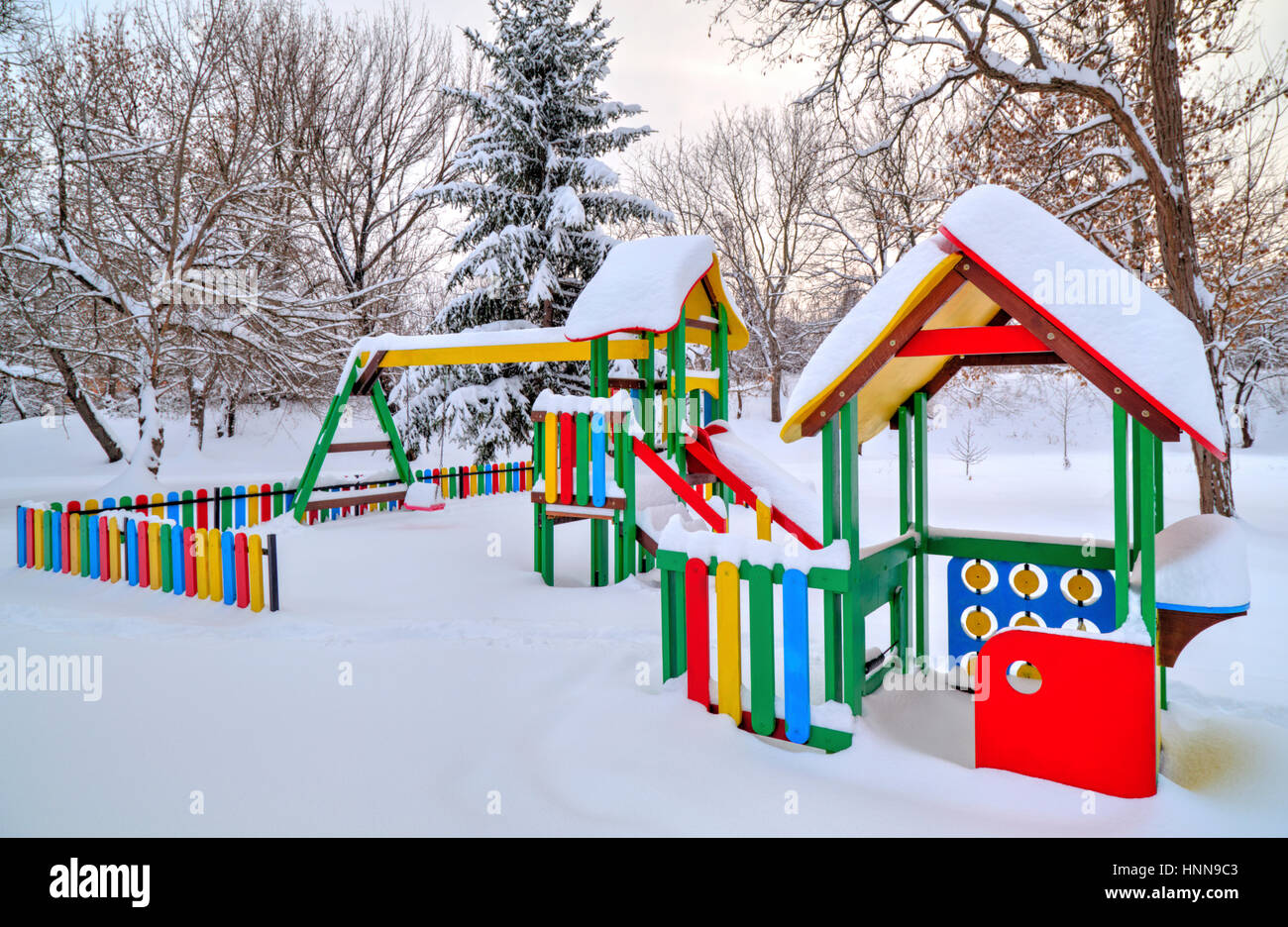 Children's playground covered with snow in winter Stock Photo - Alamy