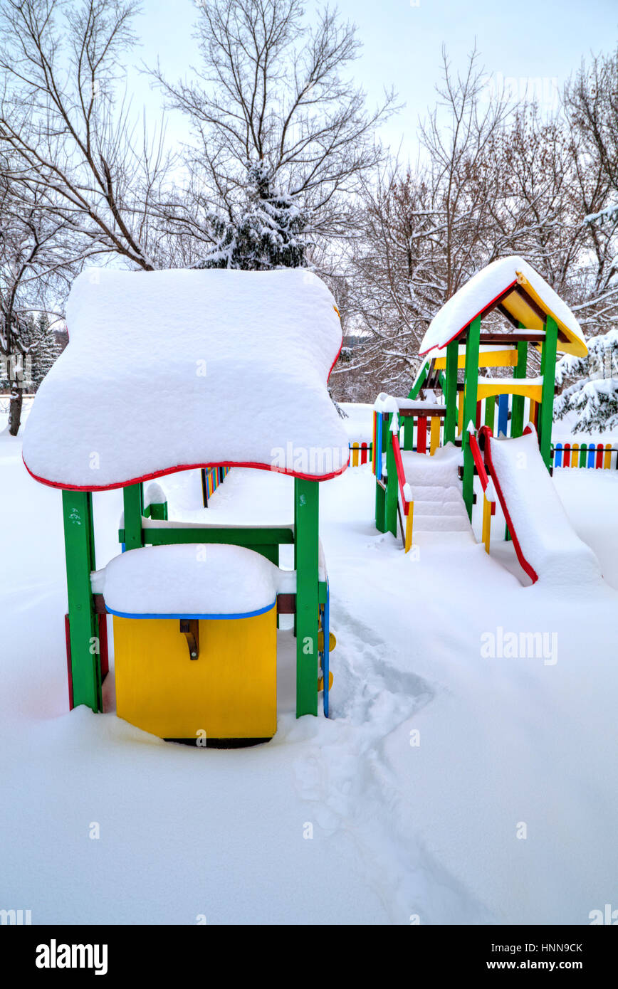 Children's playground covered with snow in winter Stock Photo - Alamy