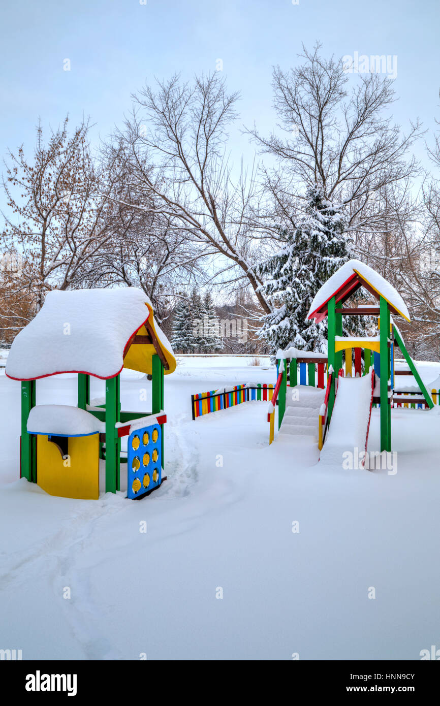 Children's playground covered with snow in winter Stock Photo - Alamy