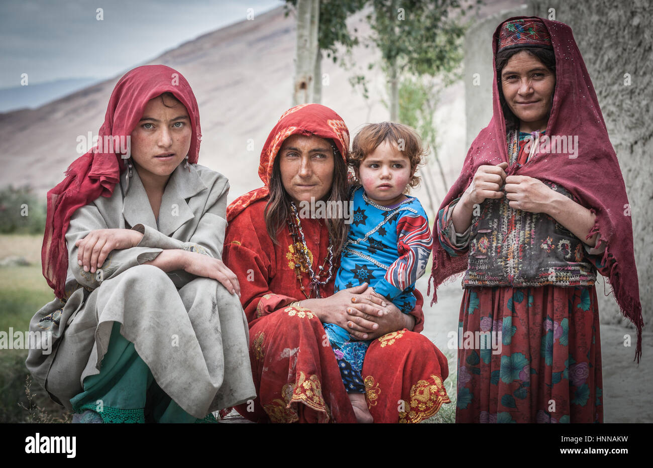 Afghanistan, Wakhan corridor, a family photo mother and children in traditional colored clothes