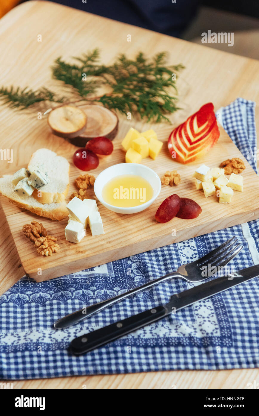 plate with blue cheese Dor, parmesan, Brie Stock Photo