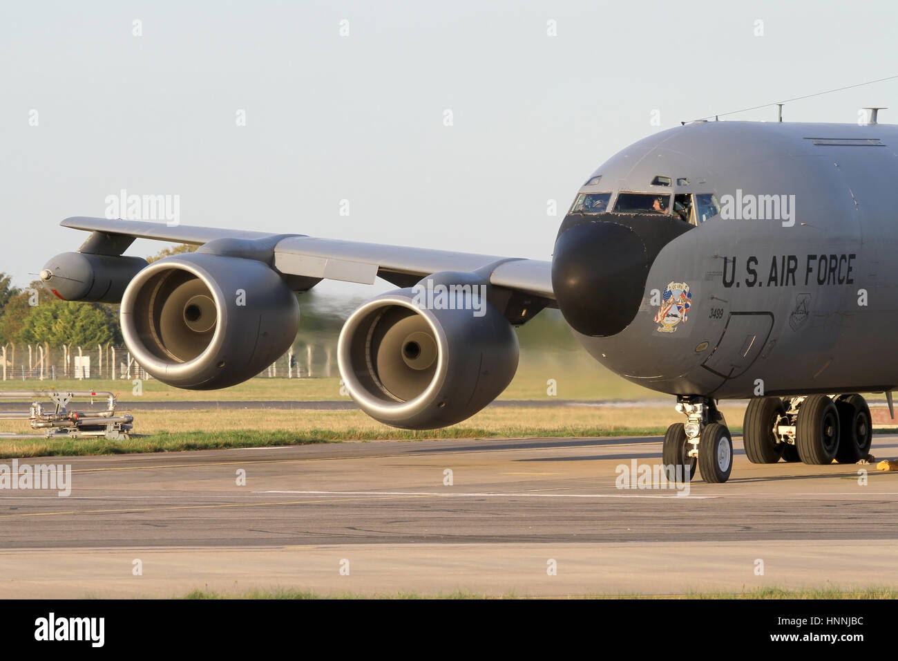 100th Air Refuelling Wing KC-135R tanker at Mildenhall starting it's CFM-56 turbo fan engines. Slow shutter used to show movement in the fan blades. Stock Photo