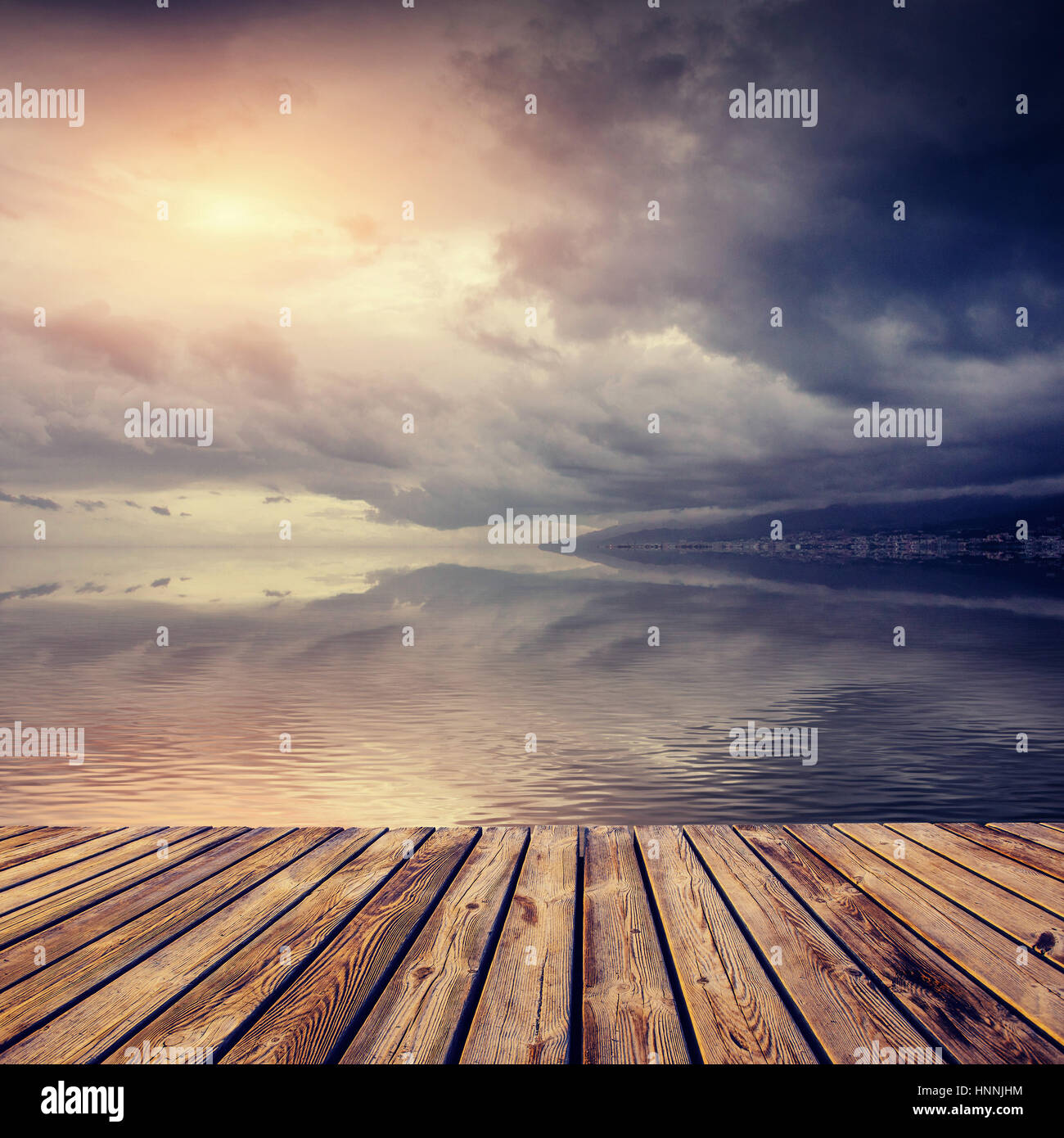 Beautiful sunset over sea with reflection in water, majestic clo Stock ...