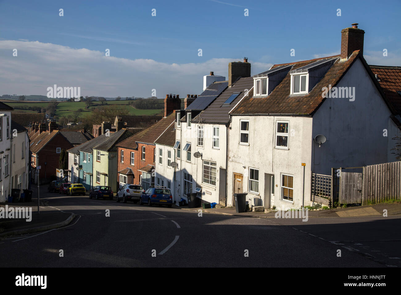 View looking from Victoria Place in Axminster town centre, down Castle Hill to open Devonshire countryside. Stock Photo