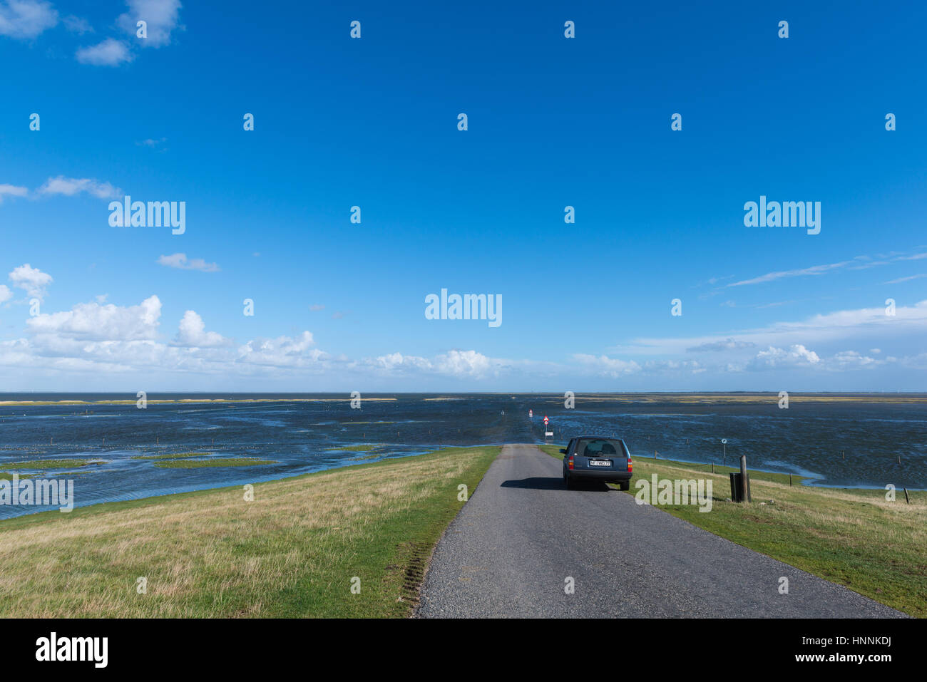 High tide coming in on the road from Mandoe Island to the mainland, Danish Wadden Sea, UNECSCO World Natural Heritage, North Sea, South Jutland, Denma Stock Photo