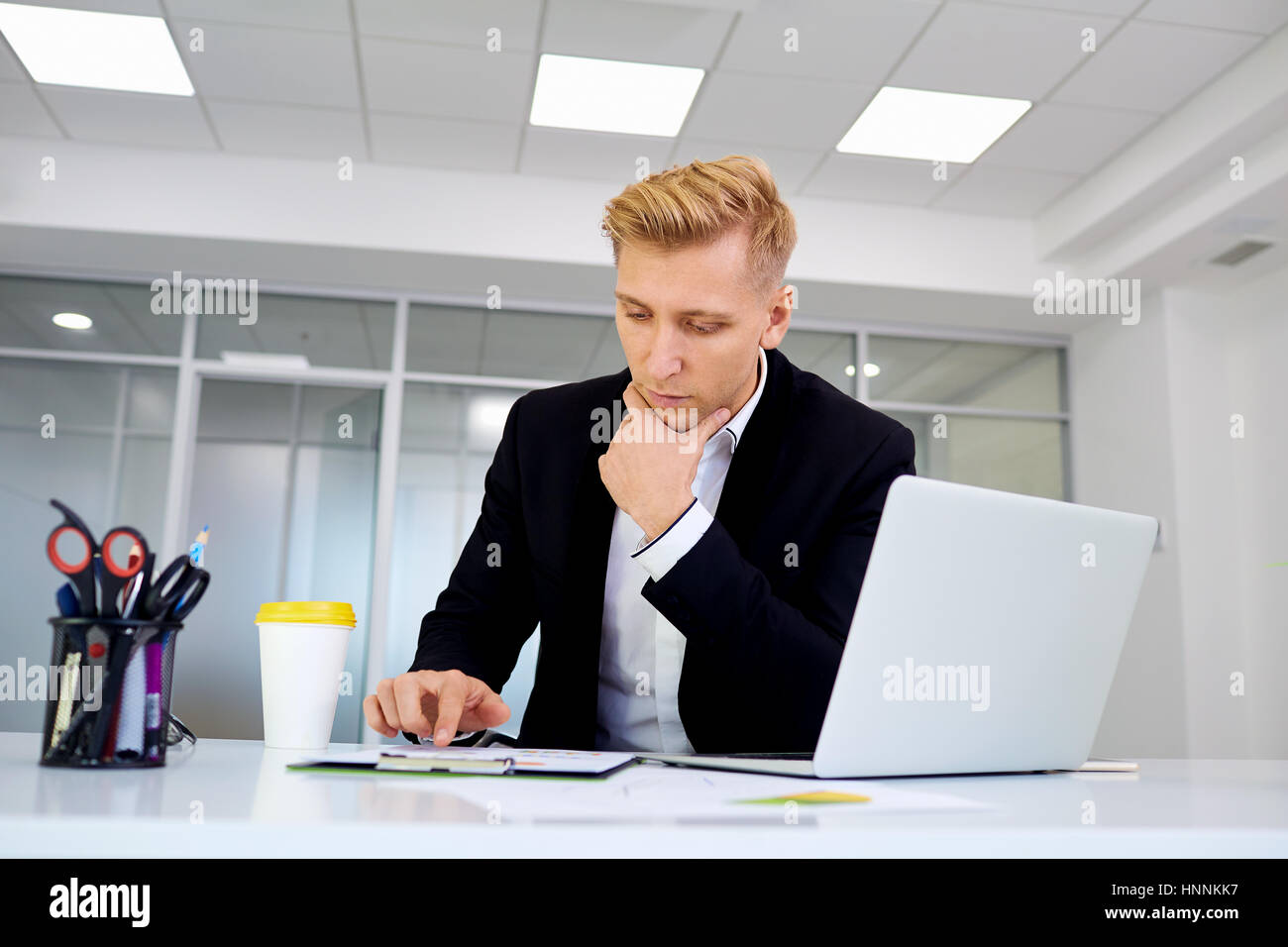 Businessman with  the laptop work at a desk  office Stock Photo