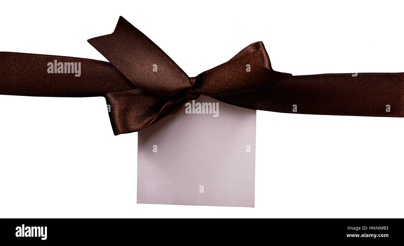 brown ribbon with paper label isolated on white background. Brown bow clipping path Stock Photo