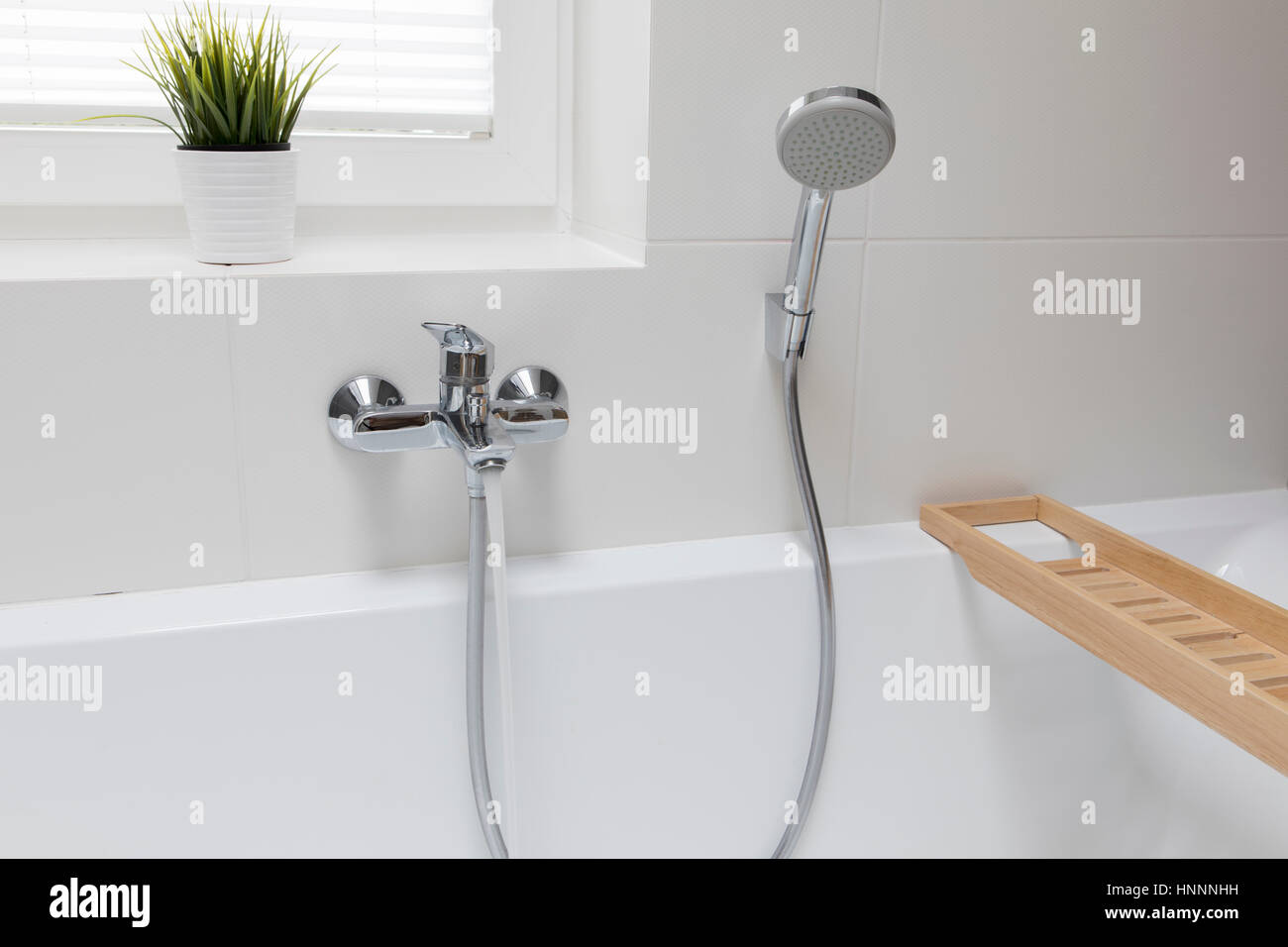 Closeup of faucet and hand shower in bathroom Stock Photo Alamy