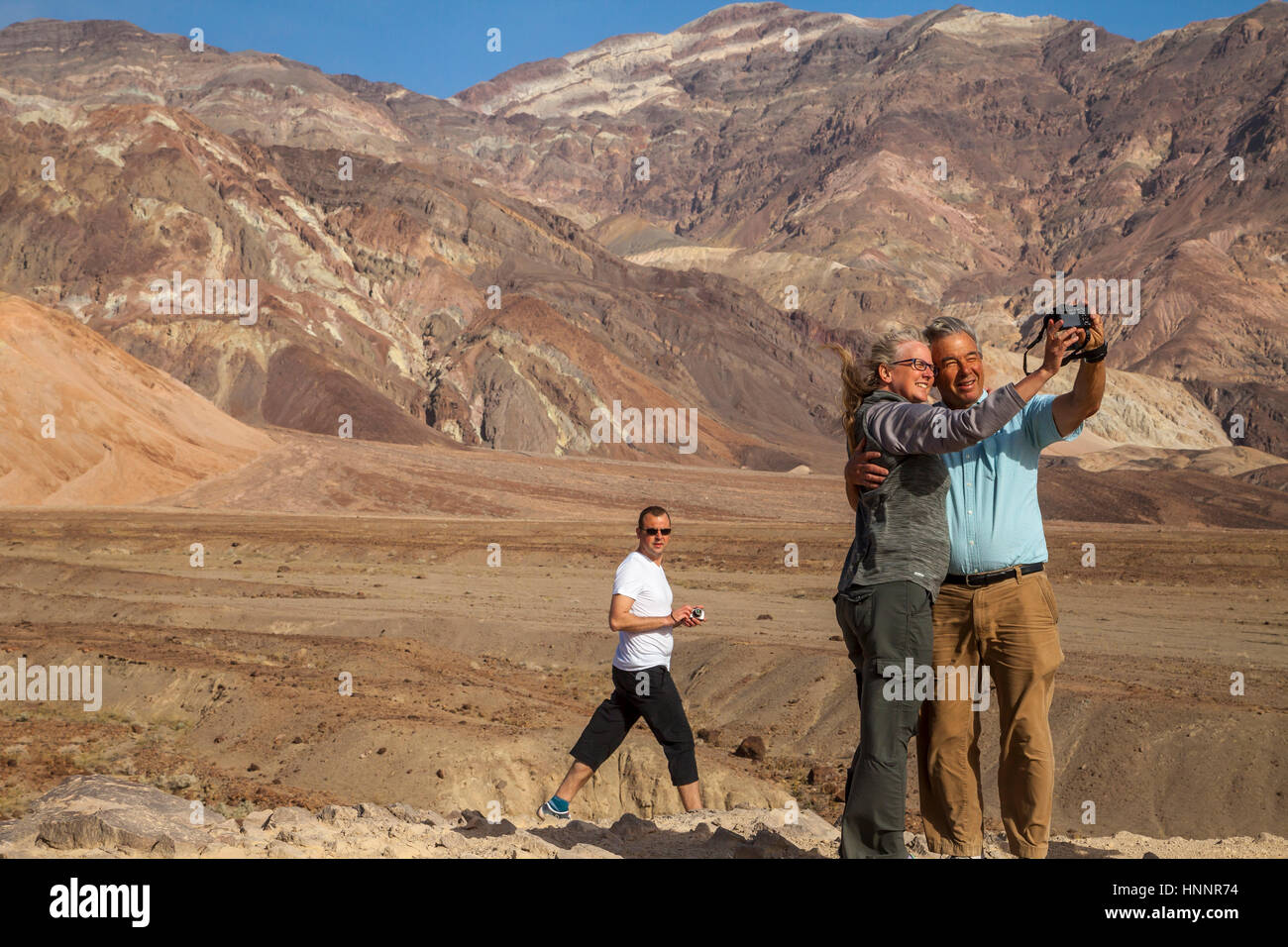 Couple taking selfies in Death Valley, California, USA Stock Photo