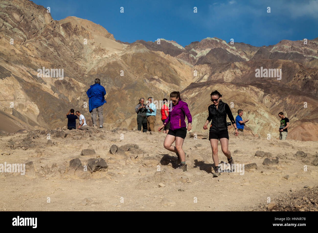 Female tourists coming down the hill in Death Valley, California, USA Stock Photo