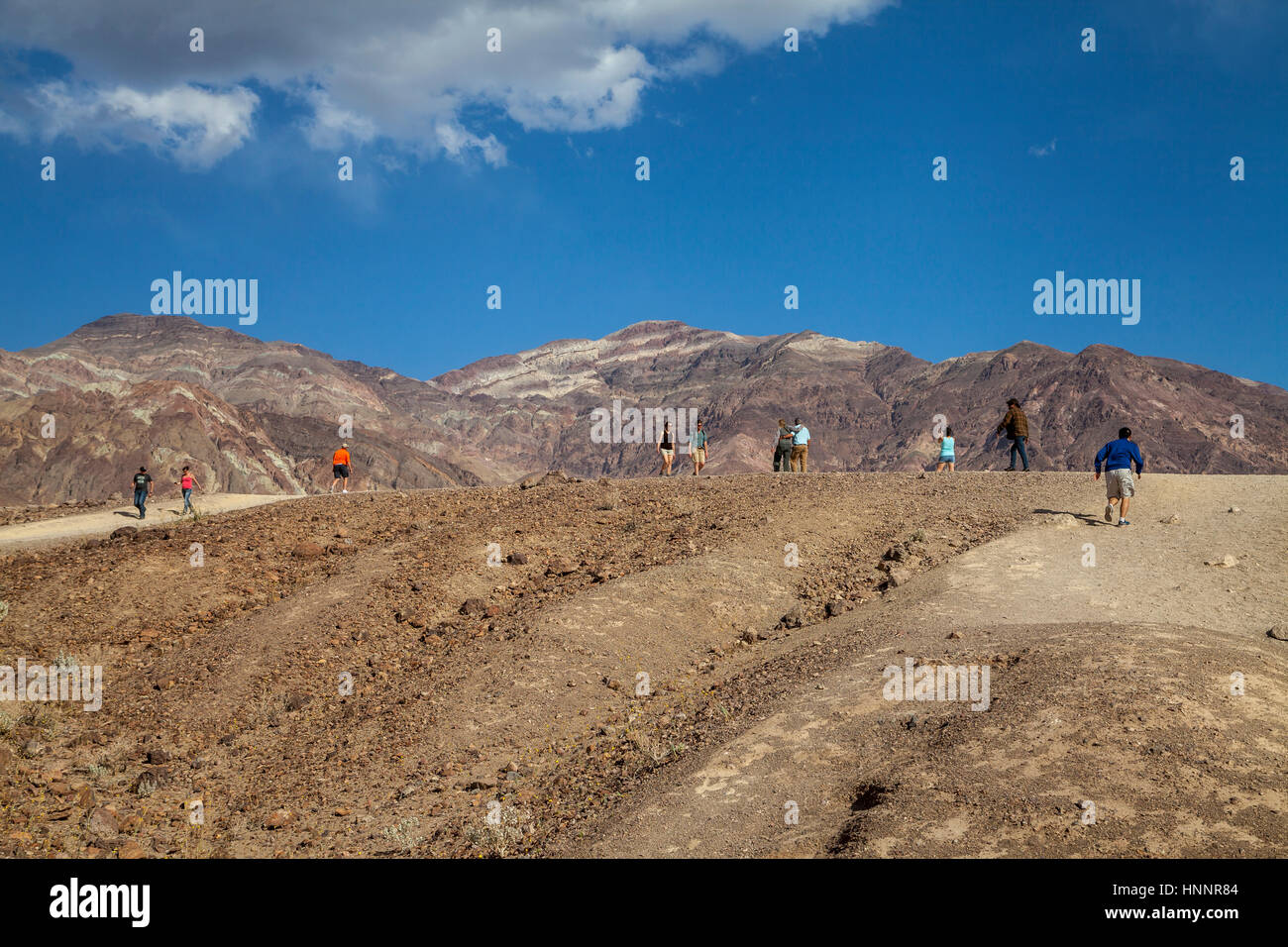 Tourists hiking on a trail in the Death Valley National Park, California, USA Stock Photo