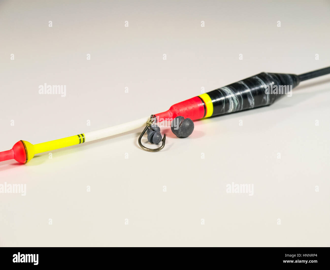 The sinker, float and the hook. Closeup. Isolated on a white background