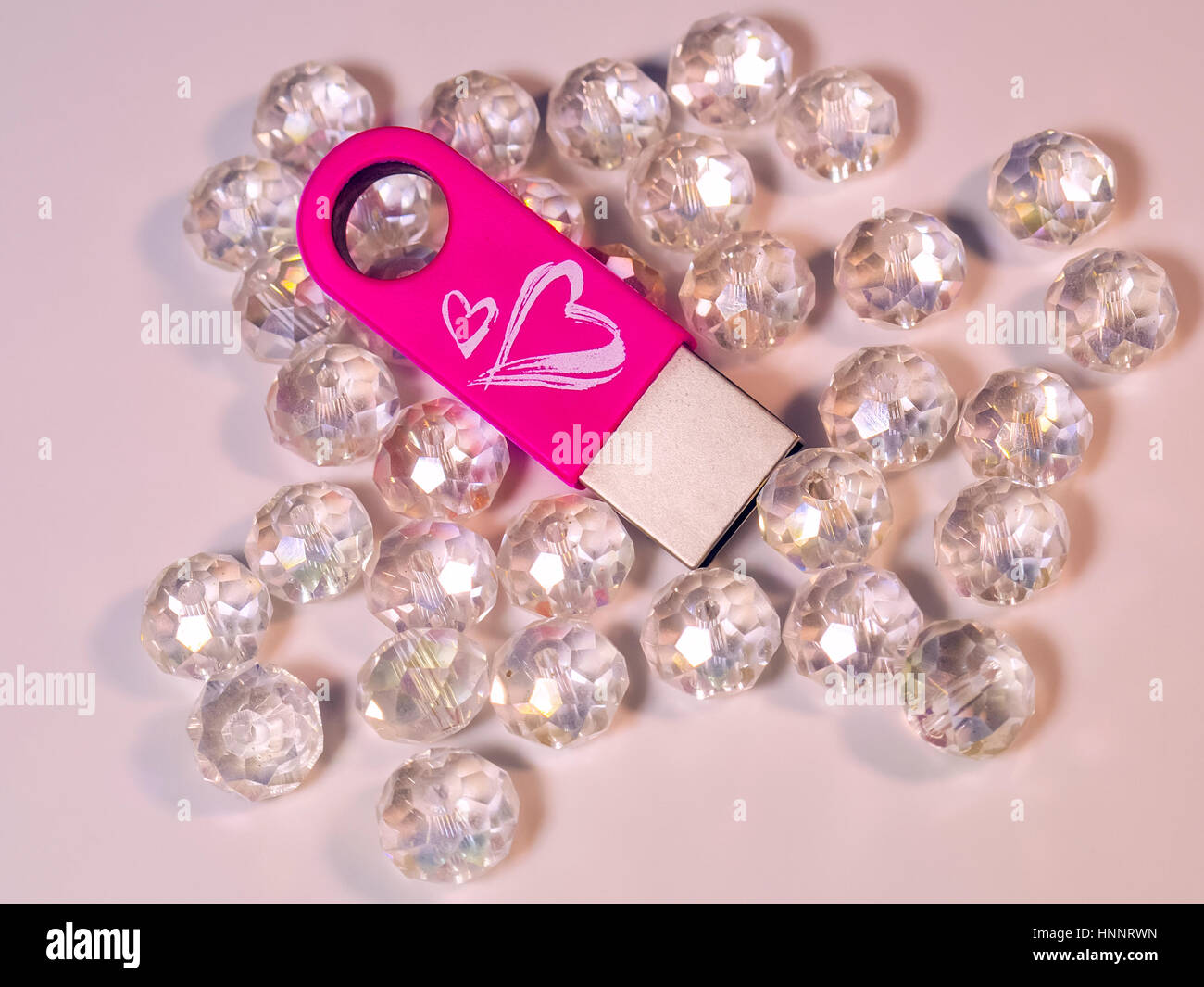 The pink USB flash drive with heart and gems Stock Photo