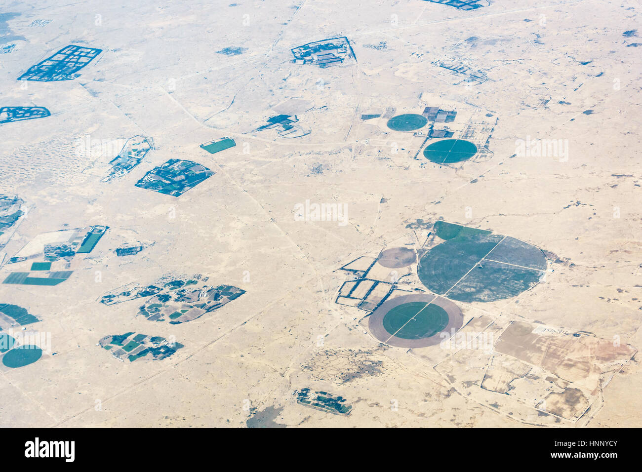 Aerial view of circular fields in the desert in Qatar Stock Photo