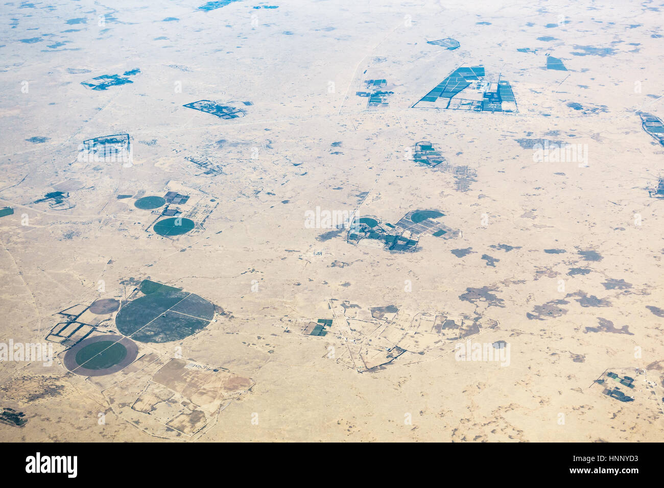 Aerial view of circular fields in the desert in Qatar Stock Photo