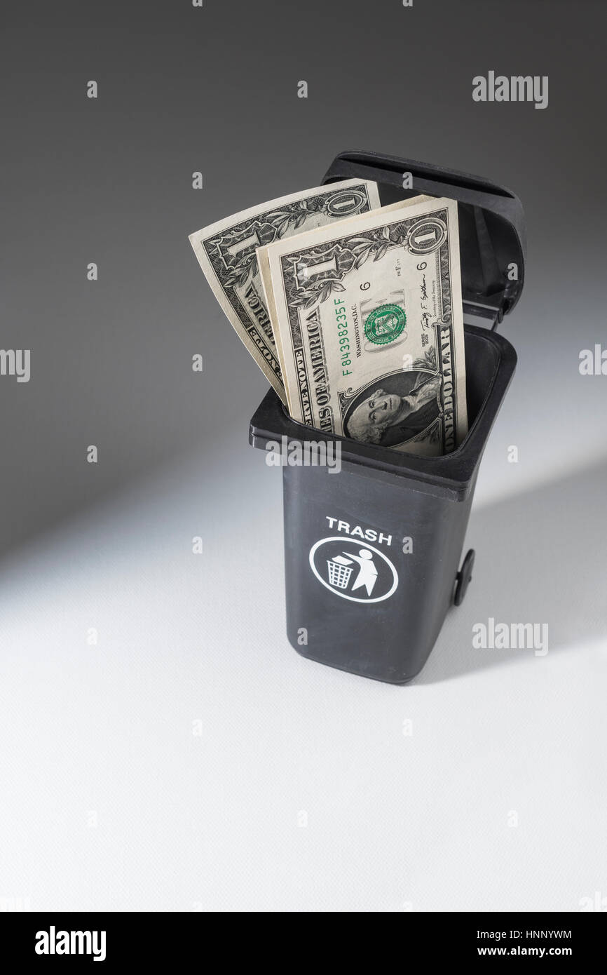 US 1 Dollar banknotes / bills in a toy wheely bin / wheelie bin