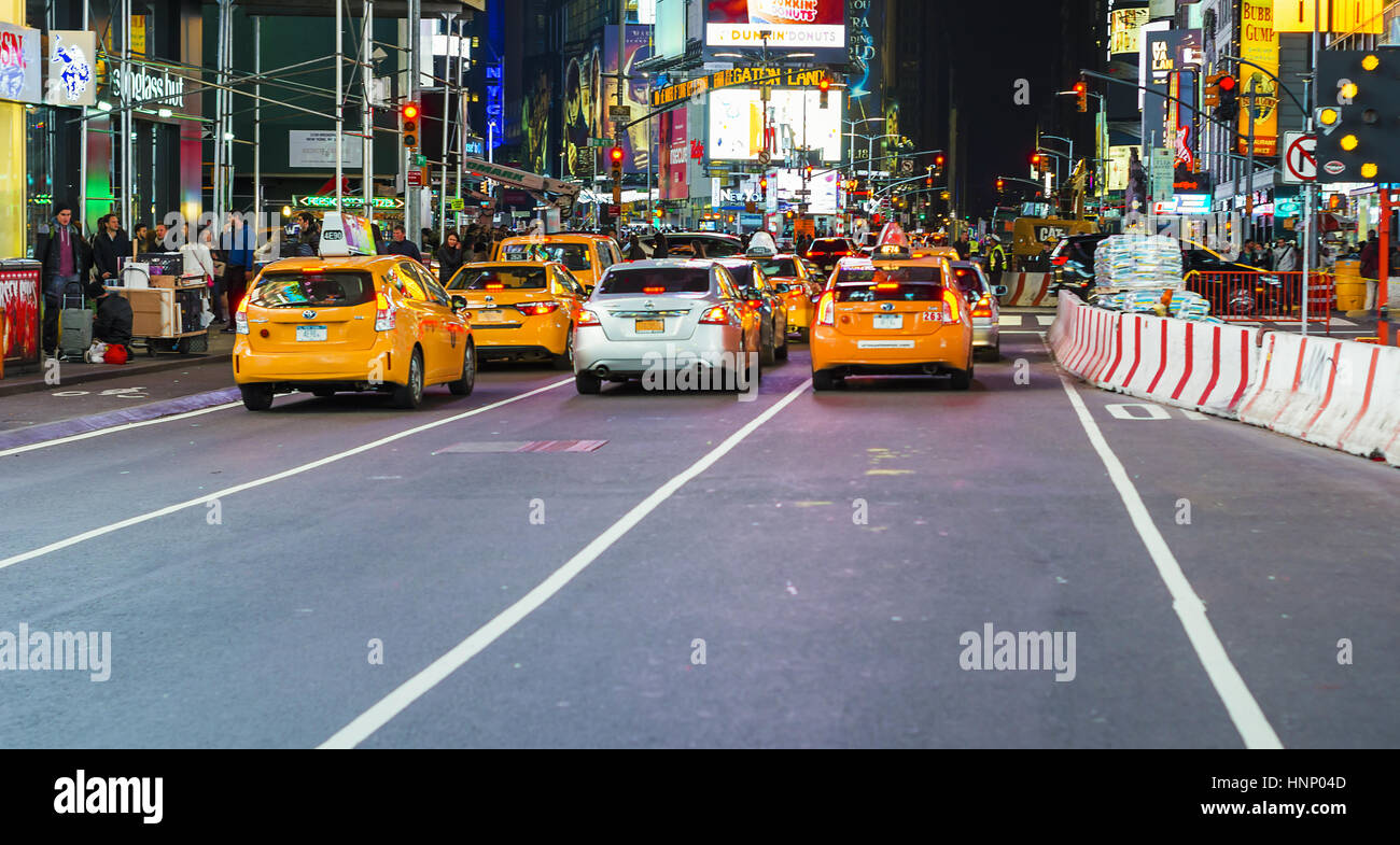 New York, USA, november 2016: yellow cabs in Times Square crowded with people Stock Photo