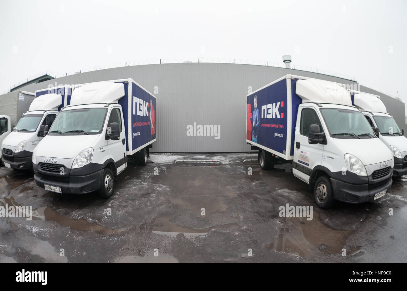 ST. PETERSBURG, RUSSIA - CIRCA JAN, 2016: Small lorries parking lot with empty place. Russian transportation company PEC (First expedition company) is Stock Photo